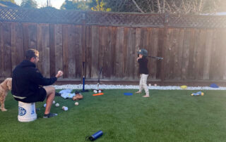 Parent playing catch with their child coach David Klein